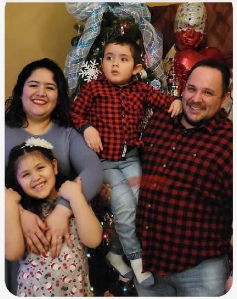 Marquez Family Picture with mom, dad, young girl, and young boy